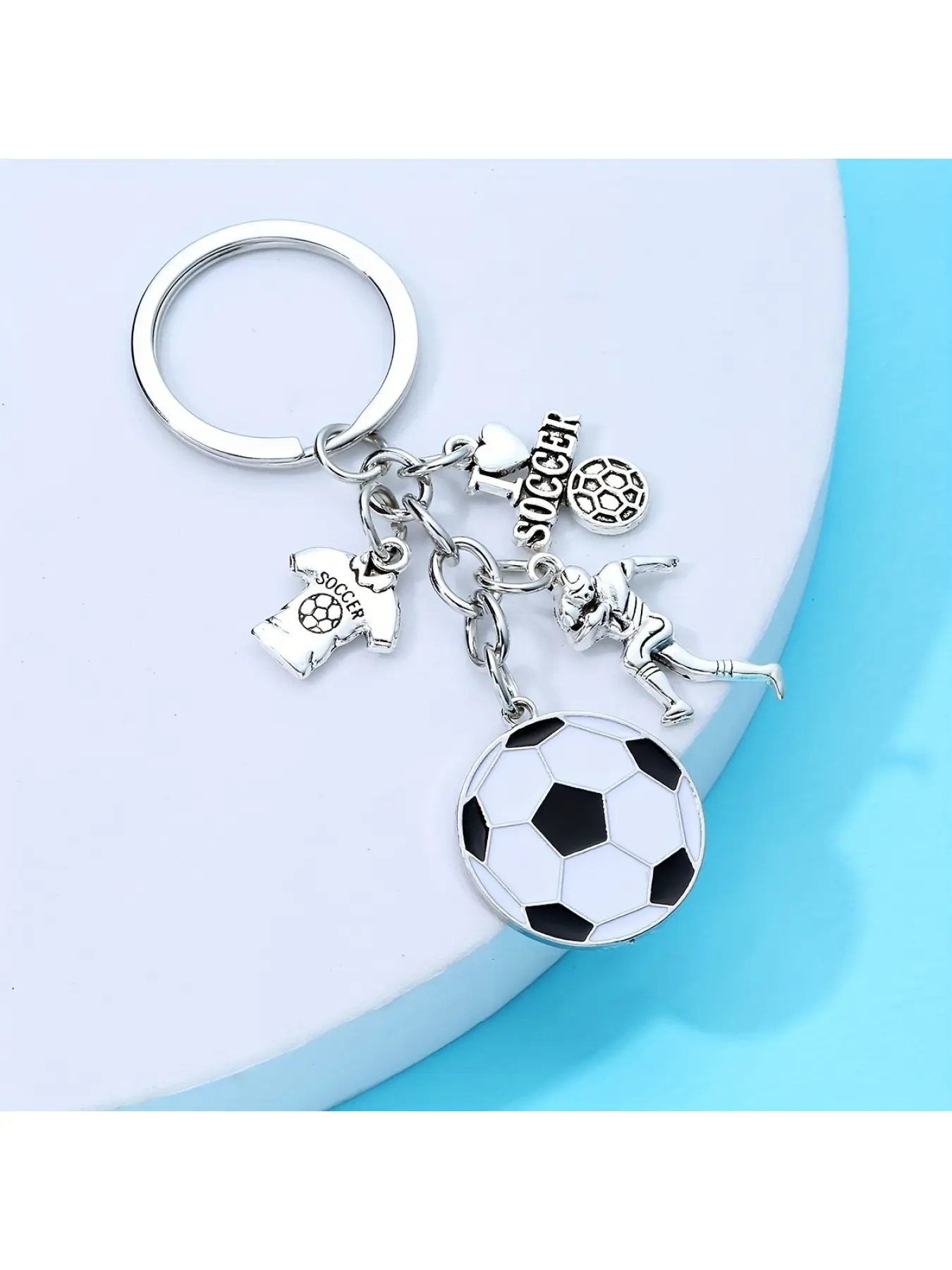 A keychain featuring a football player's image, suitable as a small gift for fans and supporters, Soccer Player Keychain, Soccer Player Charms