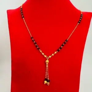 Gold plated daily use Nepali Mangalsutra with black potey and multiple gold plated balls on it.