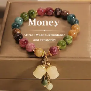 High-end rainbow tourmaline round bead bracelet, symbolizing wealth and good fortune, in a Bohemian style, paired with exquisite colorful flower pendants, a fashionable accessory suitable for both men and women.