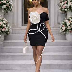 Luxe Contour Bandage Dress with Sculpting Fit Elegant Statement Piece in Black and White with Large Flower Detail