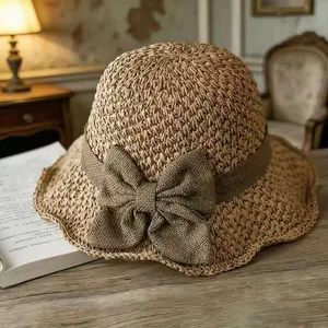 Versatile retro woven handmade straw hat with ruffled bow, elegant French sun hat, foldable, breathable travel beach hat.