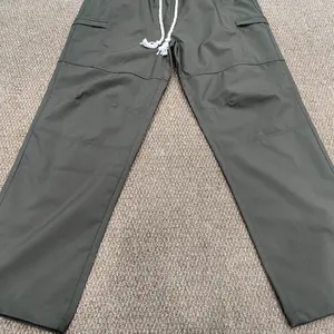 Men's Loose  Pocket Drawstring Waist Cargo Pants Casual Comfy Zipper Cargo Pants for Daily Outdoor Wear Baggy Trousers in