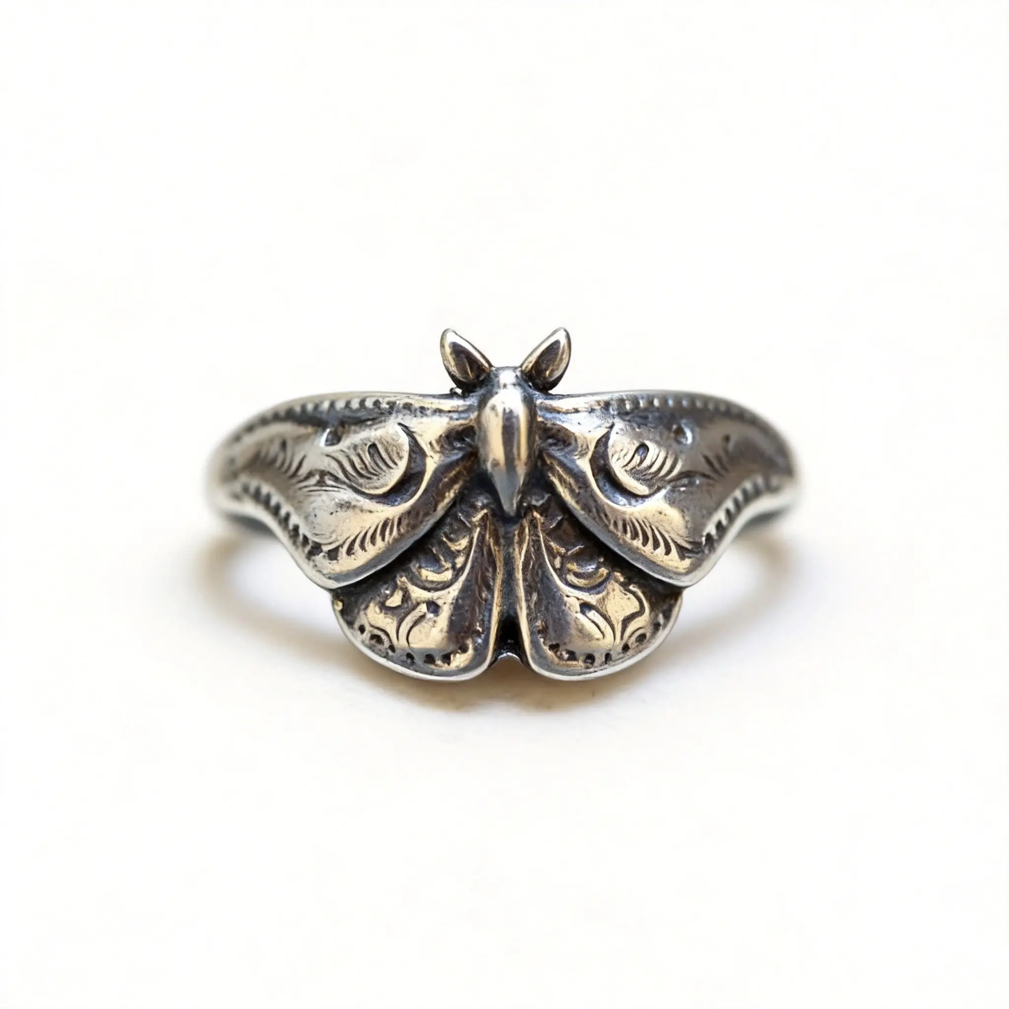 Bohemian-style moth-carved ring featuring intricate, delicate vintage scrollwork and exquisitely sculpted, three-dimensional moth wings, capturing the mysterious allure of nature—a perfect gift for special occasions.
