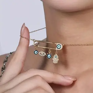 Golden Plated Evil Eye Hamsa Hand Choker Necklace with Rhinestone Safety Pin Charm – Boho Lucky Amulet for Women and Girls