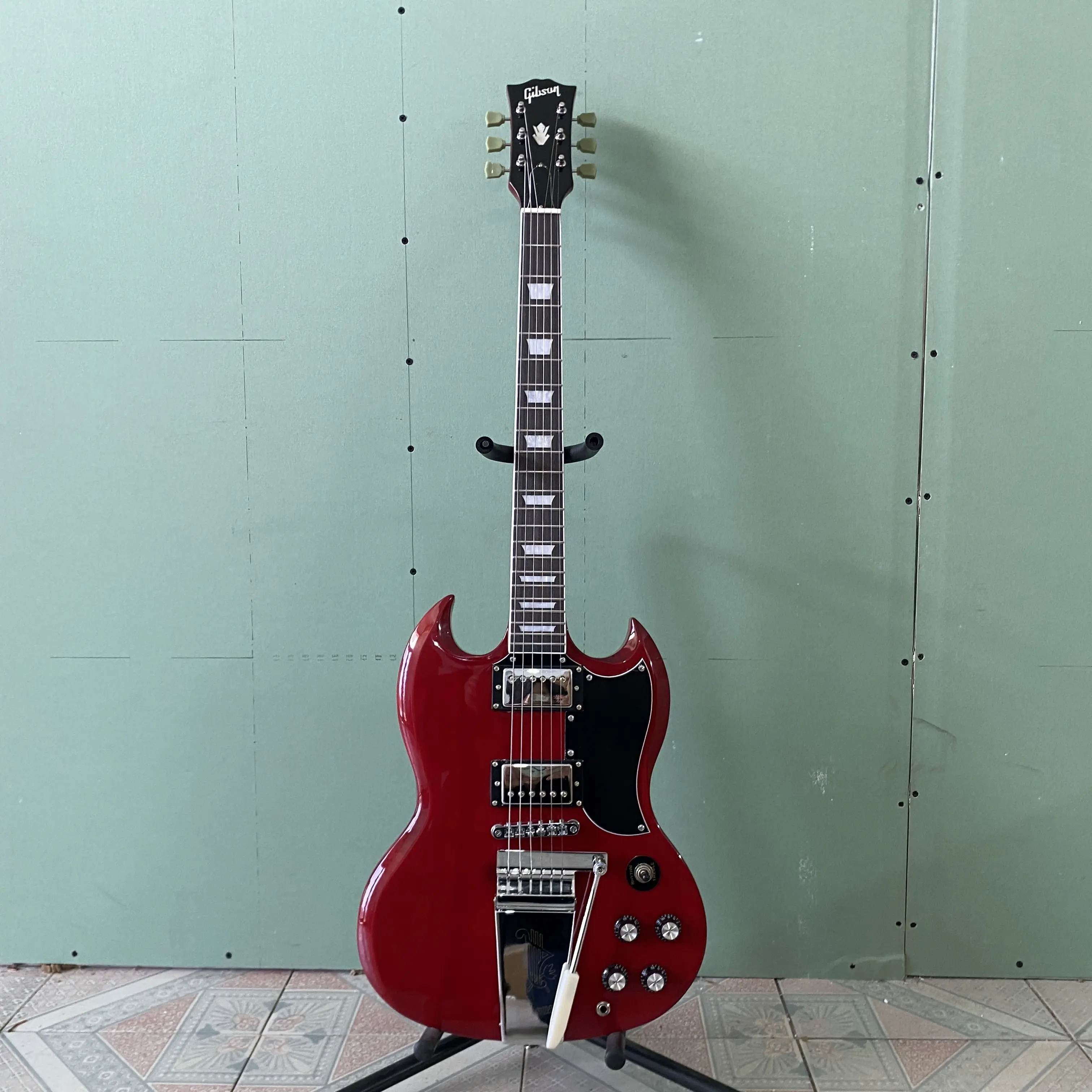 Solid Guitar Cherry Red Body , Black Pickguard Tremolo Tailpiece Chrome Hardware