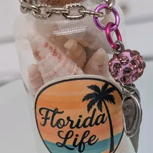 Handcrafted genuine authentic one of a kind Florida Before Us shark shell filled trinket bottle ornament featuring a wire wrapped shark tooth pendant by ToothRaiders