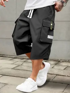 Single pack cargo shorts for summer. Men’s casual cargo shorts with an elastic drawstring waist, multiple pockets, and letter appliqué patches. Regular fit with a mid-rise that doesn’t stretch; suitable for everyday wear and leisure activities. Non-see-th