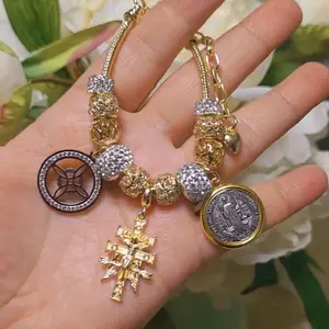 Gold plated triple proteccion bracelet, nudo de bruja , cruz de caravaca ,san benito