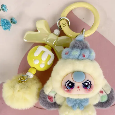 A cute pendant, Cute keychain, Keychain Kawaii, featuring multi-colored plush doll, paired with bow and pom-pom, sweet dreamy style, suitable for hanging on bags or keys, adding girlish lively atmosphere to everyday outings