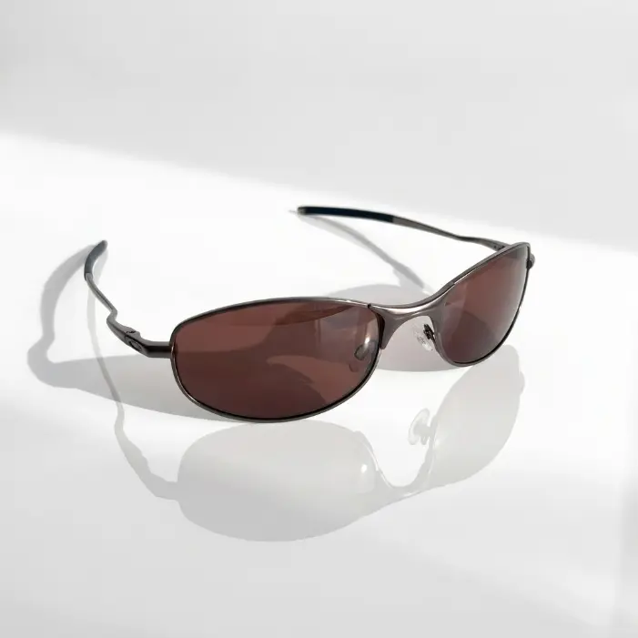 Elegant Brown Sunglasses with Sleek Metal Frame and Dark Lenses for Stylish Protection