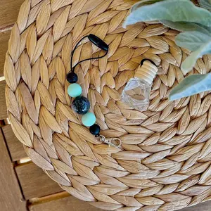 Teal and black freshie/diffuser car hanger