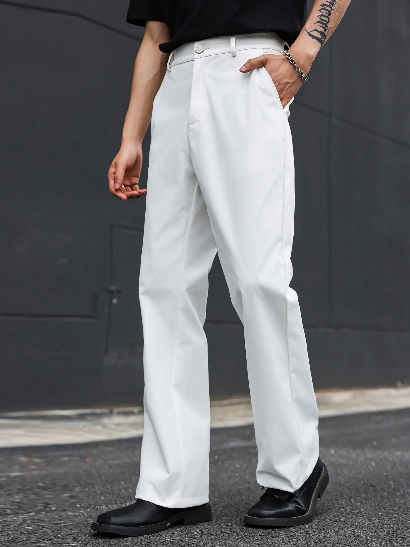 Men’s white drapey flared casual dress pants – smooth, wrinkle resistant woven fabric, button and zip closure, standard waistband, side pockets, relaxed, flattering fit, American Cleanfit minimalist commute pants for everyday wear, dates, and Instagram st