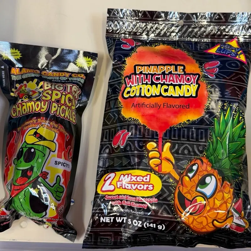 TikTok Challenge begin!!!  Alamo Spicy Chamoy Pickle with Pineapple Chamoy Cotten Candy. 1 of each. Perfect for summer celebrations and 4th of July parties