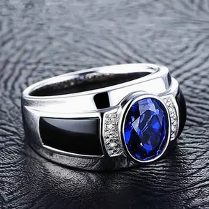 Stylish men's ring made of stainless steel, impressive design with mysterious blue-black stone, bringing a masculine charm
