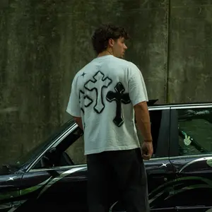 Desaints Signature White Tee with Black Cross Design