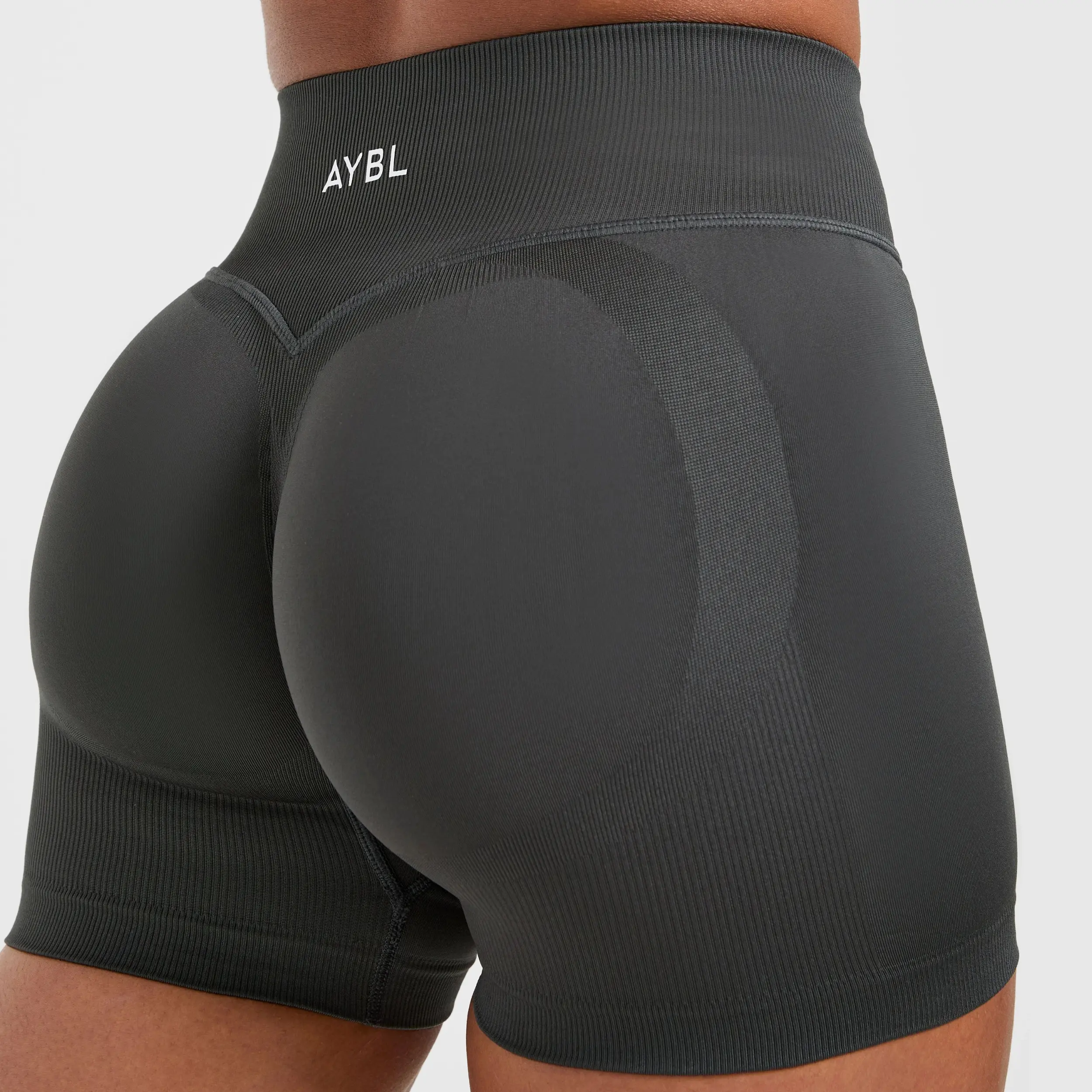 (With Logo) A.Y.B.L Adapt Seamless Gym Shorts With Logo Women's Mid-Rise V Back Waistband Engineered Scrunch Knit 49% Polyester 42% Nylon 9% Elastane True Fit Fitness Workout Yoga Running