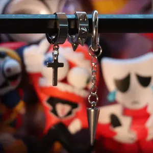 Tuff Set - A 3‑piece silver hoop earring set with cross, spike and cone designs.