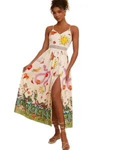 A women's floral and plant-printed halter-neck dress with an opening at the side, with a vacation-style design.