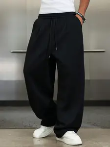 TikTok Trending! Black Baggy Sweatpants, Featuring a Loose Fit and Drawstring Waist, Perfect for Achieving a Stylish, Casual Streetwear Look When Paired with White Sneakers