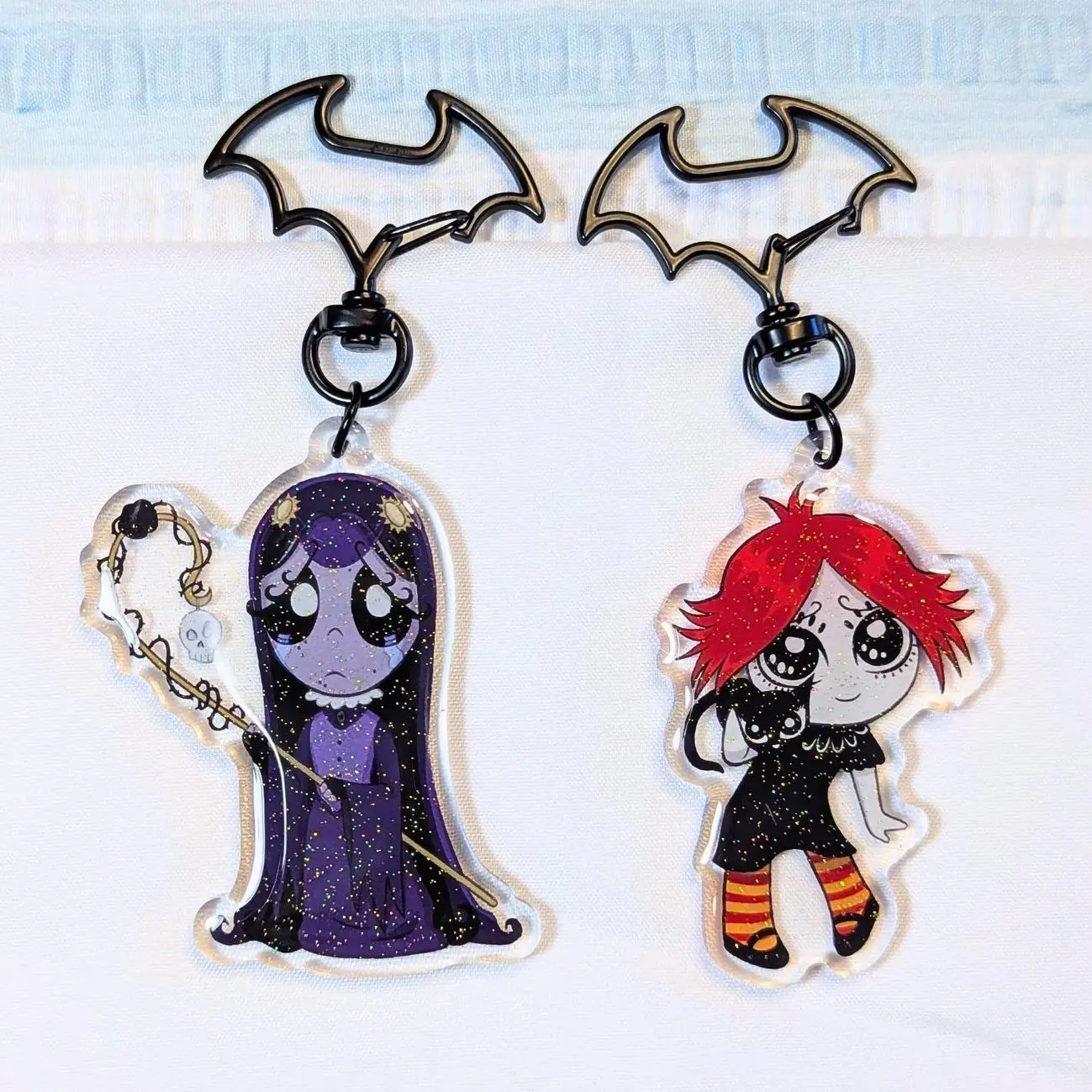 2 ops Gloomy Girl Glitter Acrylic Keychain