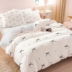 White Modern Bedding Set with black bow and heart print includes one duvet cover and 1 or 2 unfilled pillowcases. It exudes a simple and fresh style, making it a perfect gift. Soft and comfortable, it's suitable for all rooms.