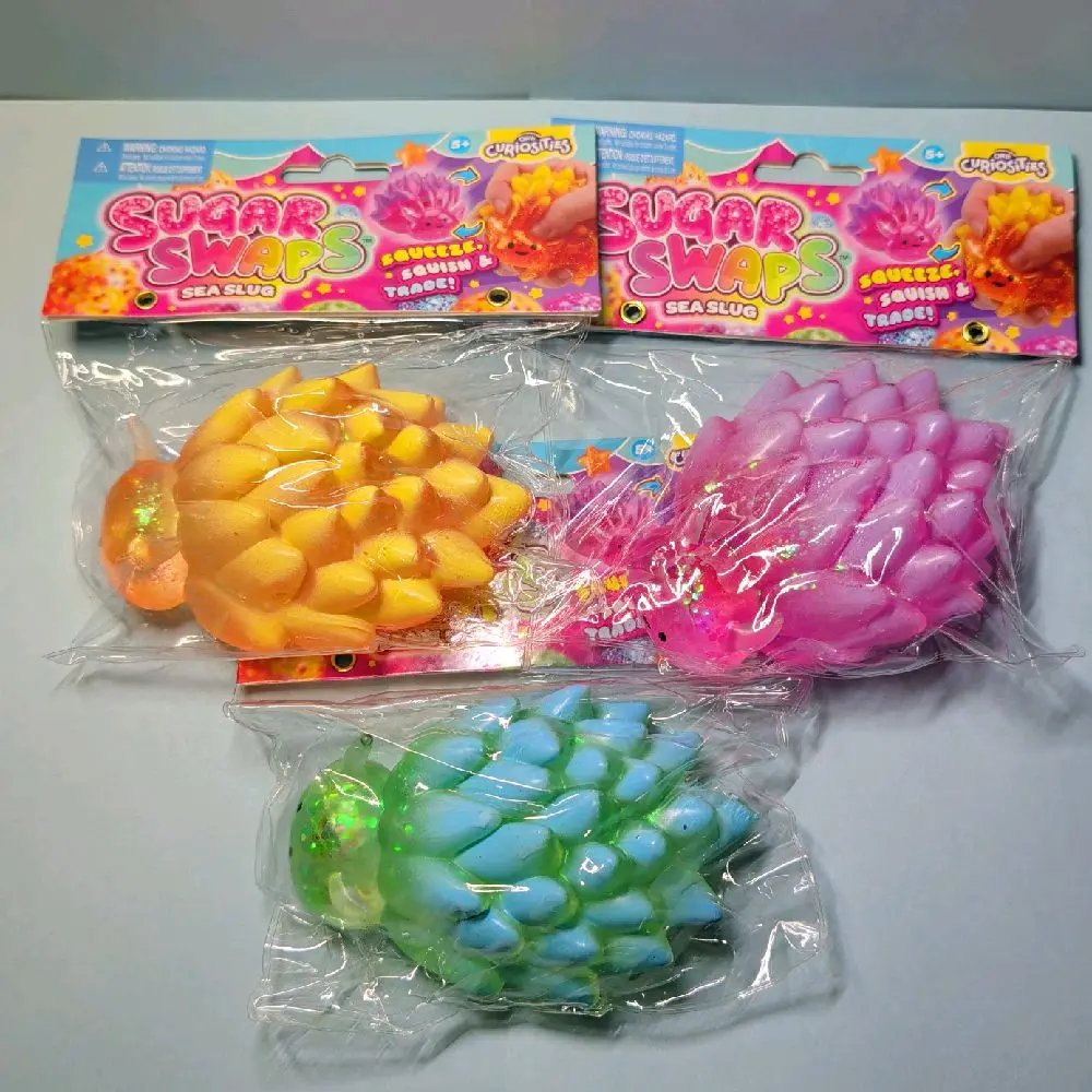 ORB CURIOSITIES!!  SUGAR SWAPS SEA SLUGS!!! STRESS RELIEF FOR AGES 5+. VARIETY OF COLORS TO CHOOSE.