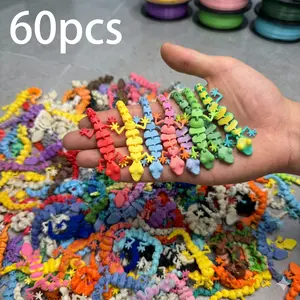 3D printed gecko figurines in 60 pieces, in various colors and ready for shipping. Suitable as gifts for Mother's Day, Teacher's Day, Children's Day and birthdays. print edgecko whimsical home decor