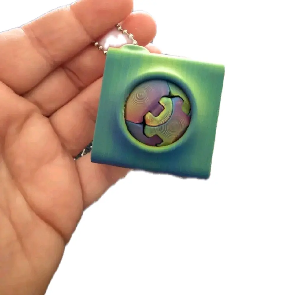 Zorbles round ball designer fingerine in carrier   Creator  is : Blob Labs Keychain Keychain Pendant