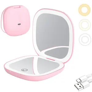 Portable travel makeup mirror, foldable, handheld, double-sided design, small and illuminated makeup mirror, suitable as a gift. Pink/white version.