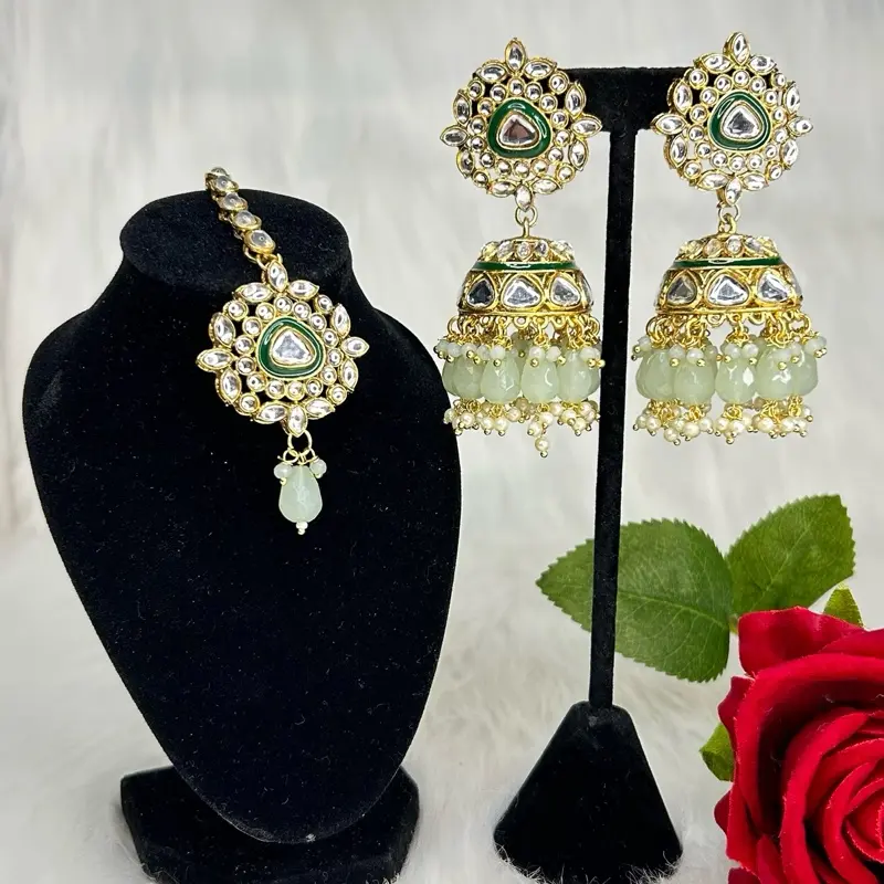 Desi Gorgeous Kundan Jhumkas And Tikka Set with Elegant Design and Vibrant Accents