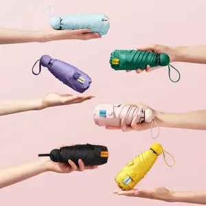 (Please note: It is mini fragile, customers who mind should not purchase it, it can only block the sun) Compact UV Protection Travel Umbrella pocket size umbrella capsule umbrella portable folding umbrella Ladies' exclusive pocket umbrella Windproof