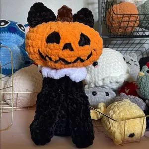 Handmade Crochet Pumpkin Cat with Adorable Black Ears and Orange Jack-o'-Lantern Head Perfect for Halloween Decor
