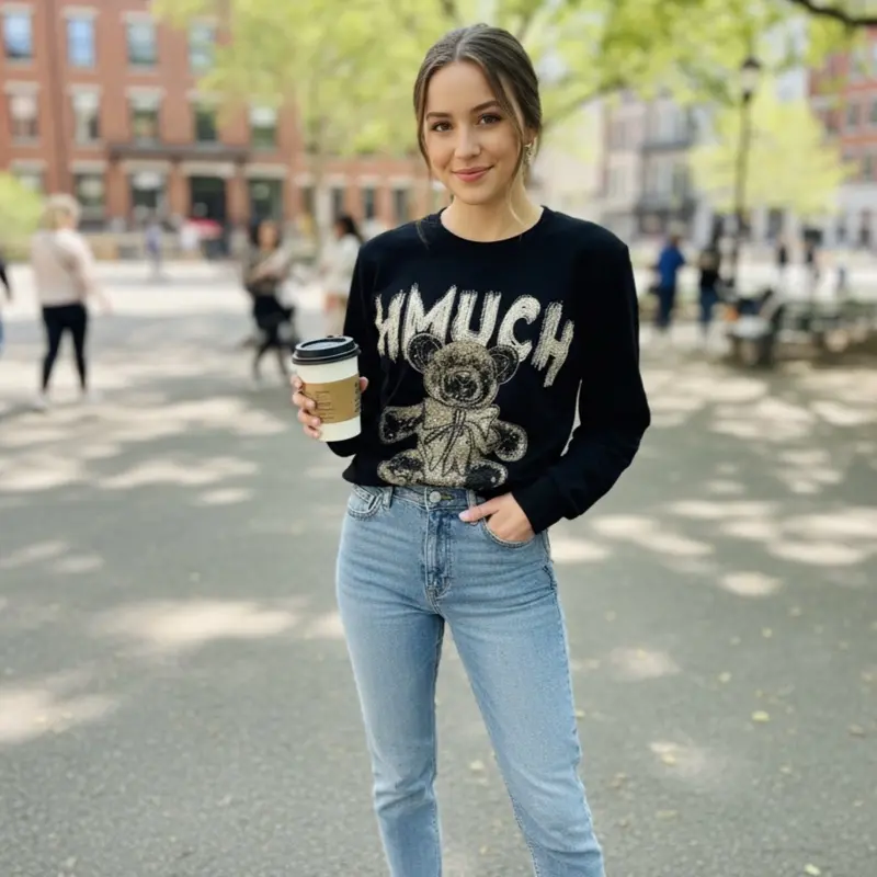 Jessy99-Sweater with rhinestones and a round neckline