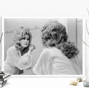 Dolly parton applying facial make-up Poster