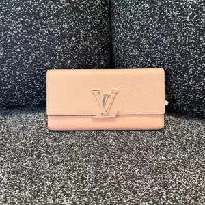Pre-owned Louis Vuitton LV Pink Taurillon Leather Wallet with Long Flap, Card Holder, and Silver LV Initials Logo