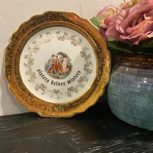“Sisters before misters” plate