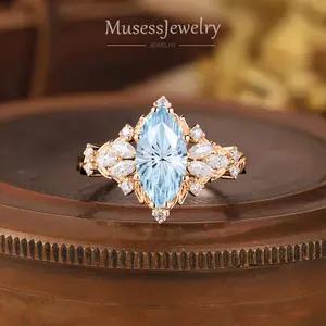 Rose Gold Marquise Aquamarine Leaf Ring 1.0 ct fireworks-cut center with marquise & round Moissanite petal halo vintage floral sparkle handmade in LA made to order 7-10 days aquamarine marquise engagement ring rose gold leaf halo wedding promise ring