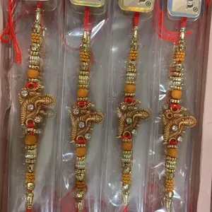Traditional Rakhi Thread for Indian Festivities with Gold and Orange Beads Decorative Design