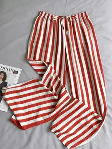 A women's Korean style lazy red and white striped wide leg loungewear Pajama pants with fashionable elastic waistband and a slimming effect, suitable for all seasons, suitable for home, indoor, and outdoor wear
