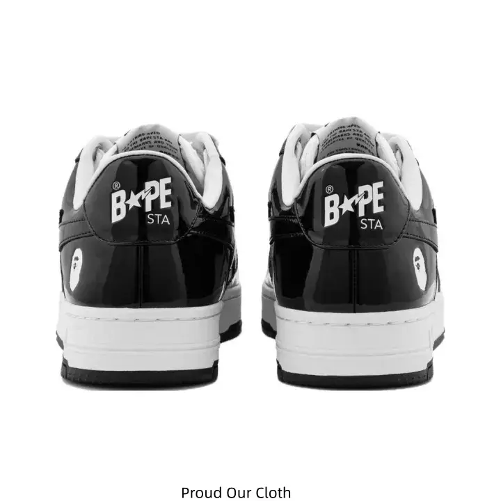 Glossy Black White Two-Tone Low Top Skate Shoes Star Graphic Side Panel Embossed Letter Heel Tab Street Casual Sneakers Rear View