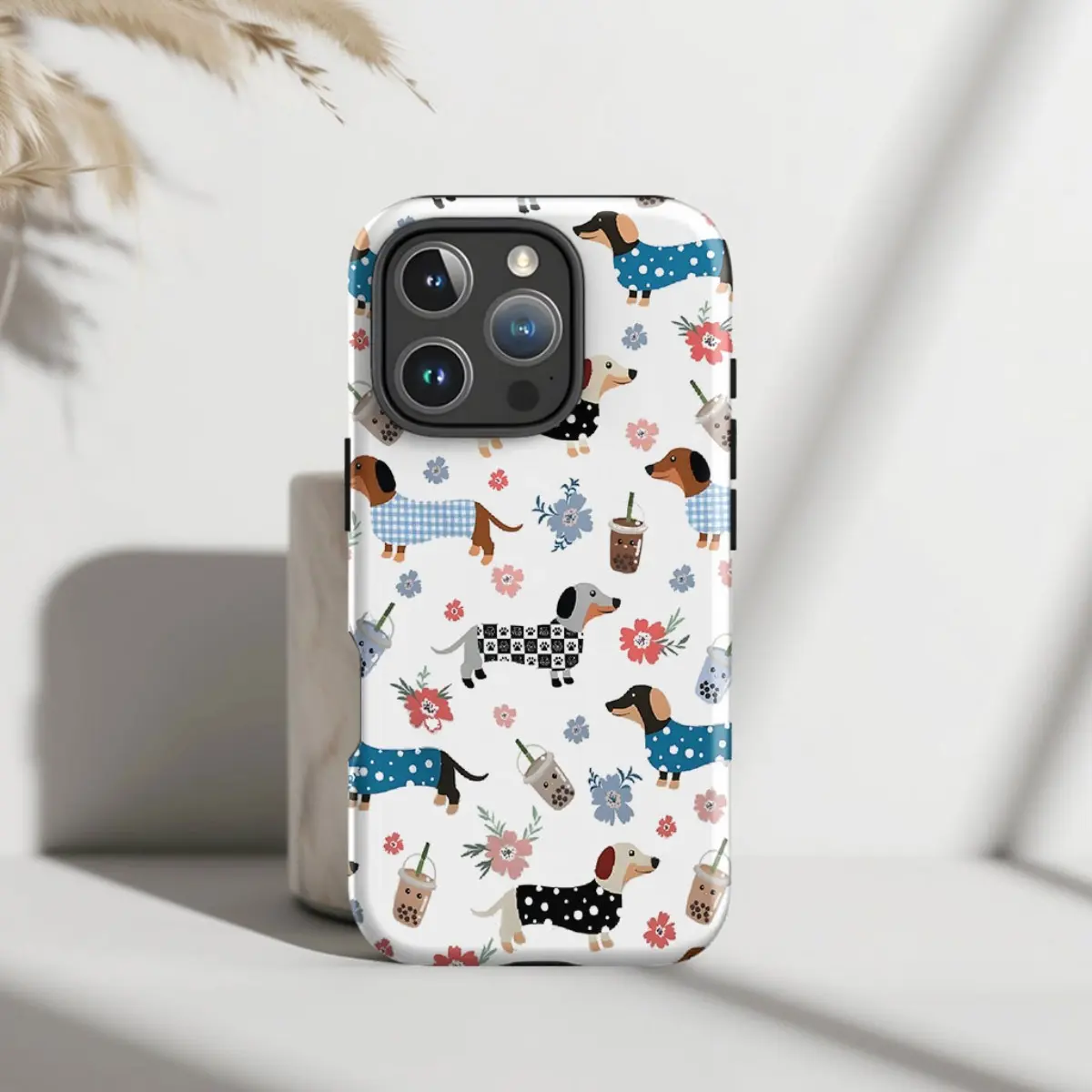 A cute floral and stylish artistic design for dachshund lovers. Durable, shock-absorbing, glossy 2-in-1 phone case, compatible with iPhone 17, 16, 15, 14, 13, 12, 11, X, Samsung and other models. Makes a great holiday gift for friends or family.