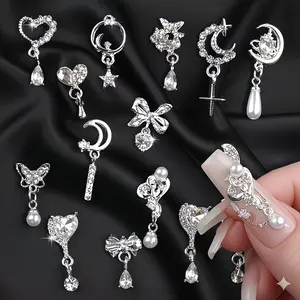 MonkeyBro Y2K Nail Charms Set 15pcs Silver Heart Bow Star Moon Tassel Pearl Crystal 3D Butterfly Metal Accessories for DIY Nail Art Salon Decor Glitter Press-on