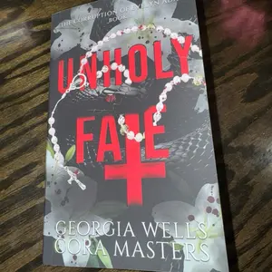 Unholy Fate Paperback by Cora masters and Georgia wells. Signed  with swag!