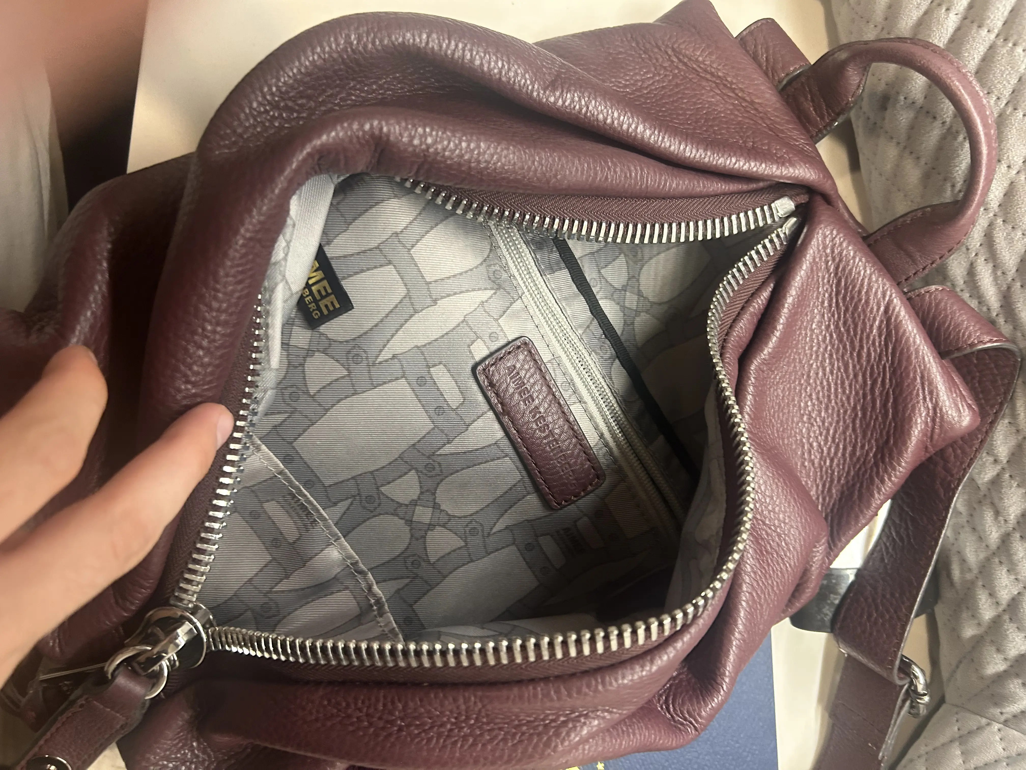 Tumi Burgundy Pebbled Backpack Silver Hardware Zip Closure Adjustable Straps