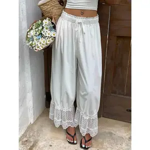 Women’s long bloomers/pajama bottoms with lace trim, elastic mid-rise waist, ruffle detailing, flared cropped cut