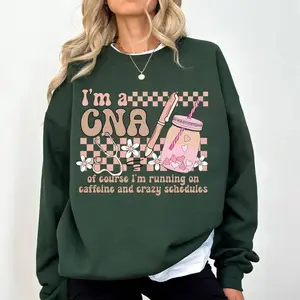 I’m A CNA Nurse Life Sweatshirt, Certified Nursing Assistant Funny Graphic Crewneck, Caffeine and Crazy Schedules Pullover, Nursing School Gift for Women– Made in USA