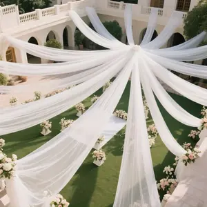 A Large Roll of High-Quality White Wedding Party Ceiling Decoration Drapes Made from Soft-Touch Polyester Mesh, Suitable for Ceremonies And Receptions. These Romantic Decorations Can Be Used for Hotel Wedding Aisles, Chair Backs, Wedding Cars