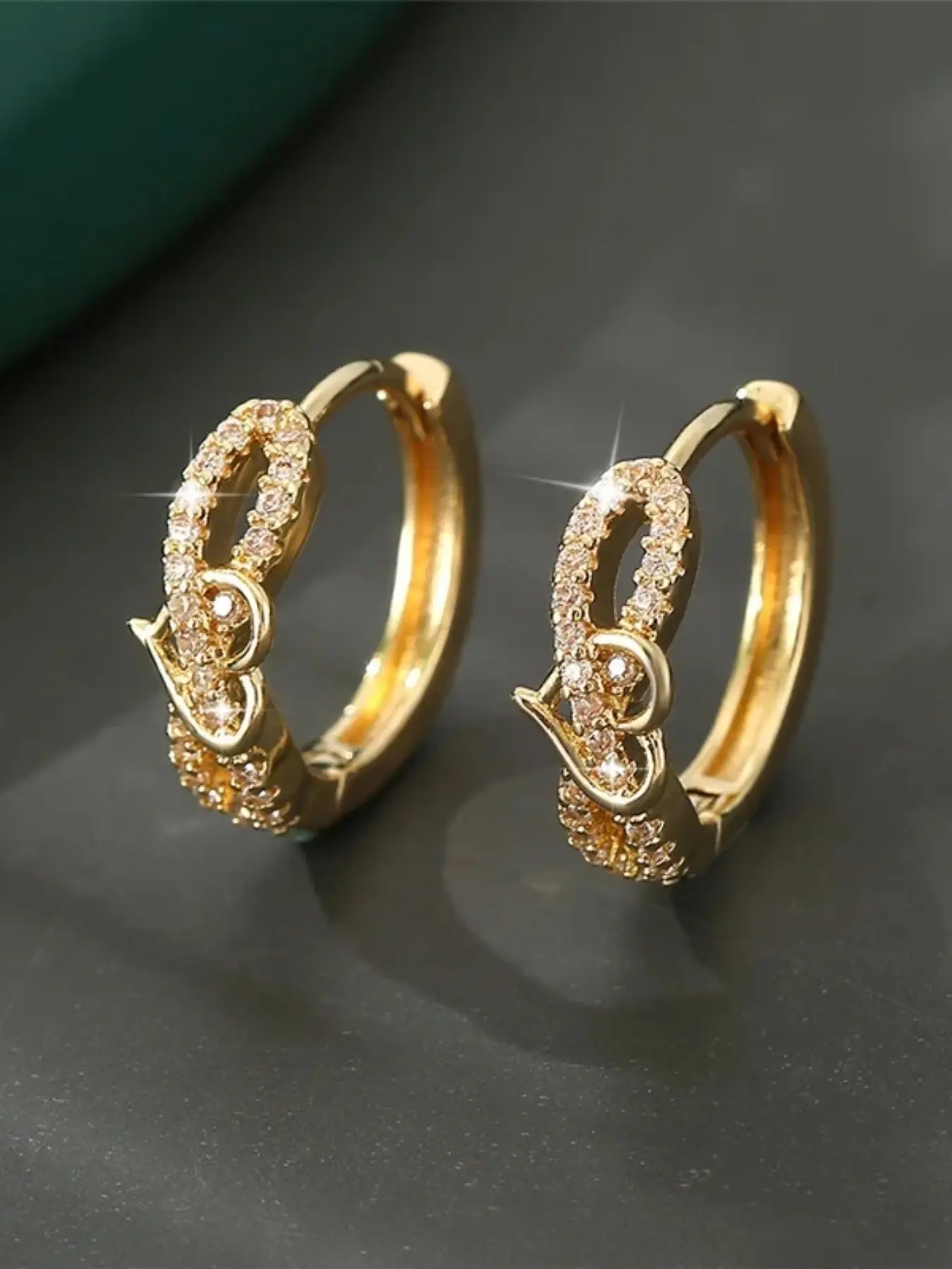 A pair of heart-shaped earrings made of synthetic white crystal, with a stylish, retro gold finish. High Quality Valentine Earrings Perfect for wearing on special occasions like weddings or holidays. Stud Earrings Jewelry