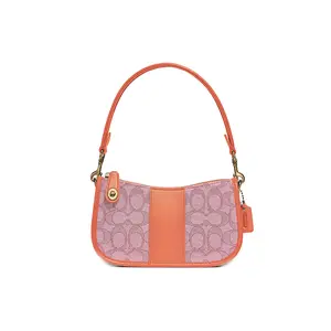 COACH Swinger 20 Jacquard and Leather Crossbody Bag for Women in Orange and Pink