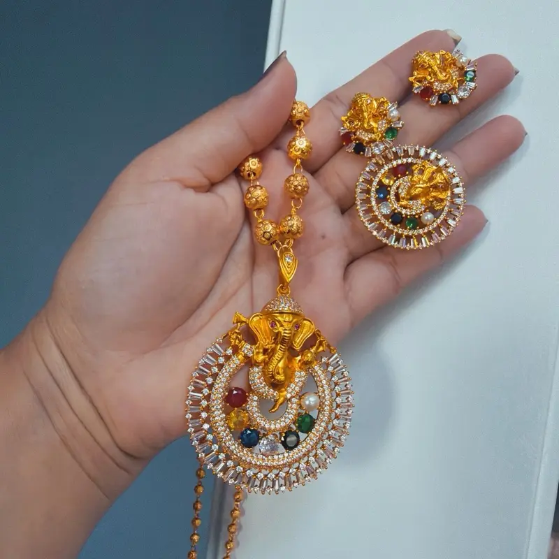 Female Auspicious Polished Gold-Tone Geometric Ganesh Navratna Pendant Ball Necklace Set with Adjustable Finger Ring & Stud Earrings